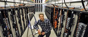 National Supercomputer Centre’s director Patrick Norman in front of the “Triolith” supercomputer (Linköping University, Sweden). It has 25,600 processors and 409 teraflops of computing power. Photo by Göran Billeson.